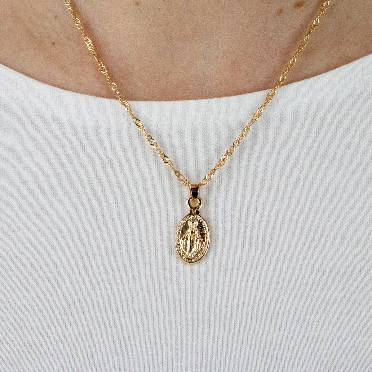 Miraculous gold medal necklace